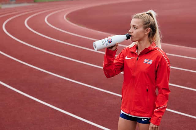 Sussex athlete Beth Kidger with one of the bottles. Photo by Drew Buckler