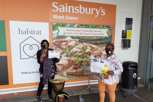 Crawley Community Action trustees Marilyn Le Feuvre (left) and Irma Stuart-Tei handed out NHS flyers to promote the Covid-19 vaccination to African and Caribbean community members on Saturday