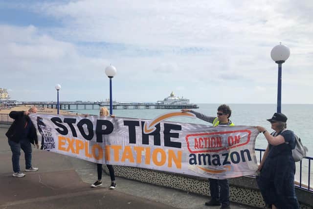 The Amazon protest by Eastbourne Pier. SUS-210608-150743001
