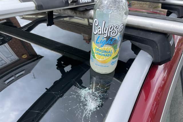 A bottle thrown onto passing traffic in Albion Way damaged a vehicle's sun roof