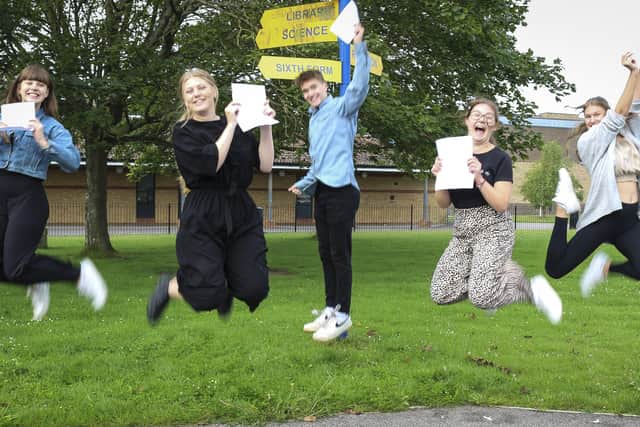 Students at The Littlehampton Academy jump for joy after receiving their A-level results.
