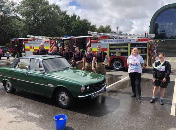 Littlehampton firefighters with a Rover 2000 they have cleaned