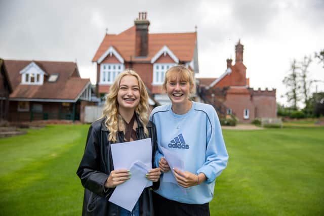 Bede’s 2021 leavers celebrating their A Level results Indi Gentry and Violet Mo Witt SUS-211008-123200001