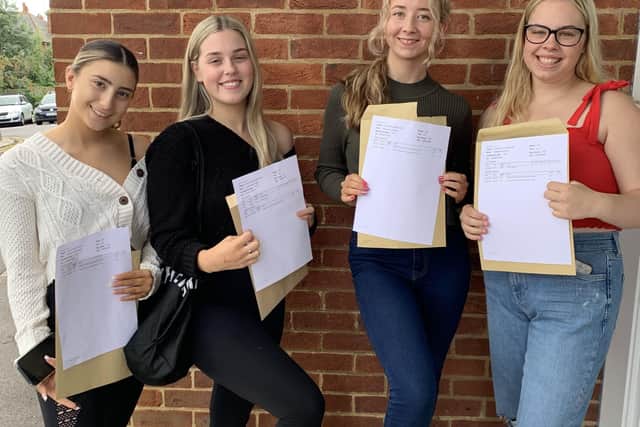Catie Brignull, Lottie Ames, Morgan Clement and Annabell Price with their results. SUS-211008-143430001