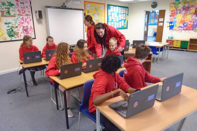 The club supported 10 local schools by providing 50 Chrome books
