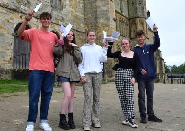 Battle Abbey School students with their GCSE results SUS-211208-114615001