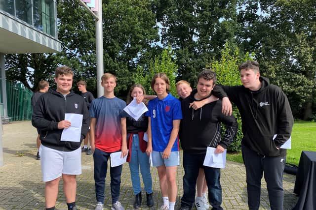 Bexhill Academy students with their GCSE results SUS-211208-133428001
