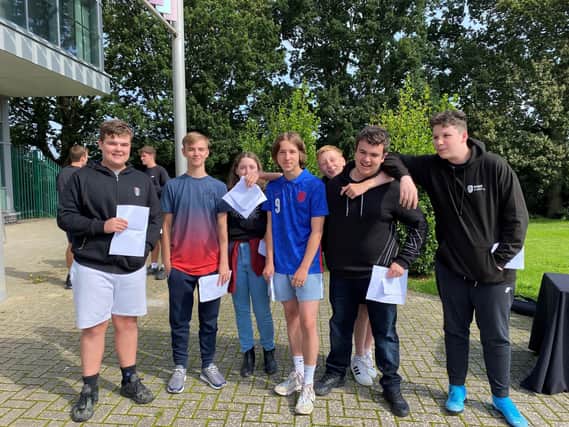 Bexhill Academy students with their GCSE results SUS-211208-133428001