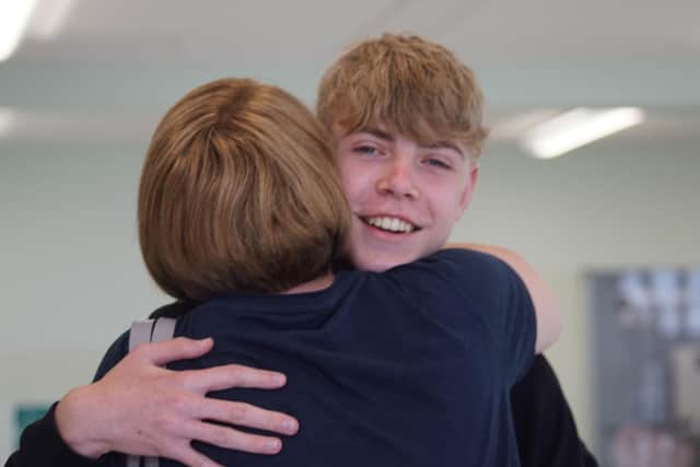 Birthday boy Lewis Fryer hugs his proud mum, Karen. Photo: Chichester High School
