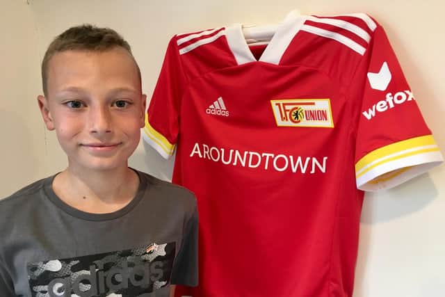 Joe with the Union Berlin shirt that was presented to him by the ambassador