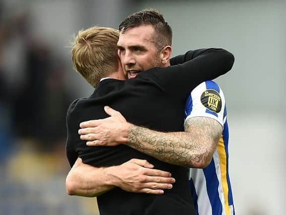Graham Potter congratulates Shane Duffy after the final whistle