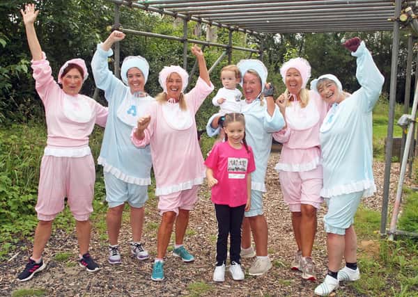 Ladies doing an assault course dressed as babies to raise money for Southampton neonatal unit. Photo by Derek Martin Photography.