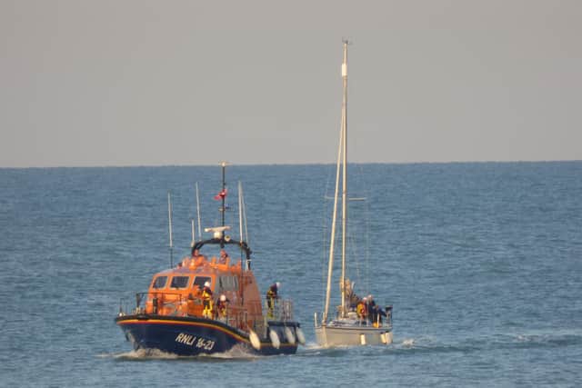Lifeboat with second casualty vessel. Picture from RNLI/Daniel Baldock SUS-210817-104343001