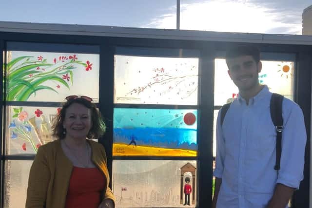 Oliver Hare's mum Ann Feloy and friend Xavier Smales with the Olly's Future glass window on Worthing Pier