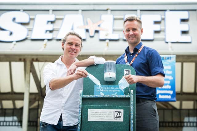 Councillor Jamie Lloyd and Brighton SEA LIFE centre manager Neil Harris with one of the new recycling bins