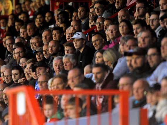 Crawley Town fans watch on against Salford City