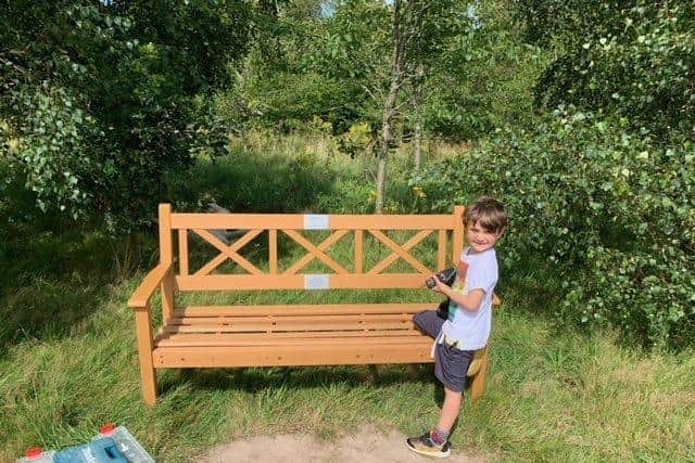 Six-year-old Billy Burns has fixed a memorial bench in Storrington after it was vandalised SUS-210818-144854001
