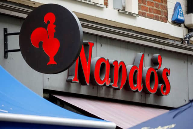 A Nando's chicken restaurant (Stock photo by TOLGA AKMEN/AFP via Getty Images)