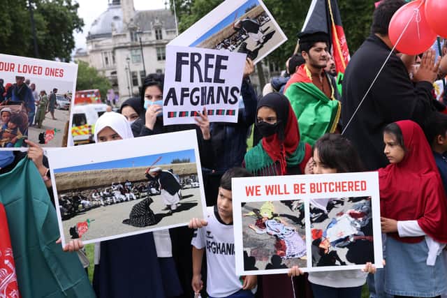 Protesters gather on Parliament Square to protest against the Taliban take over of Afghanistan on August 18, 2021 in London, United Kingdom. Photo by Dan Kitwood/Getty Images