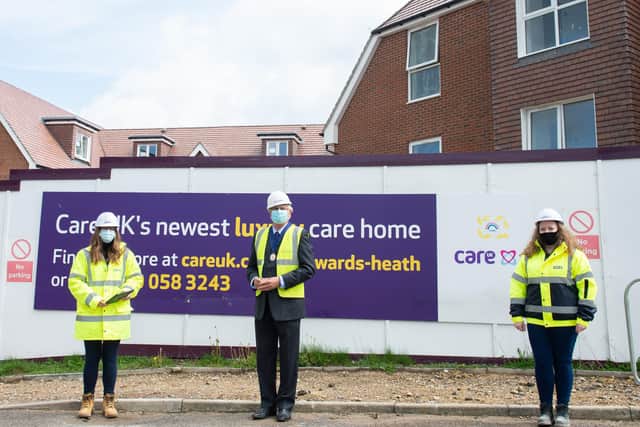 Katharine Shea, Howard Mundin and Bev Kennard outside of the building site of Martlet Manor in Butlers Green Road, Haywards Heath. Picture: Tony Kershaw, SWNS.