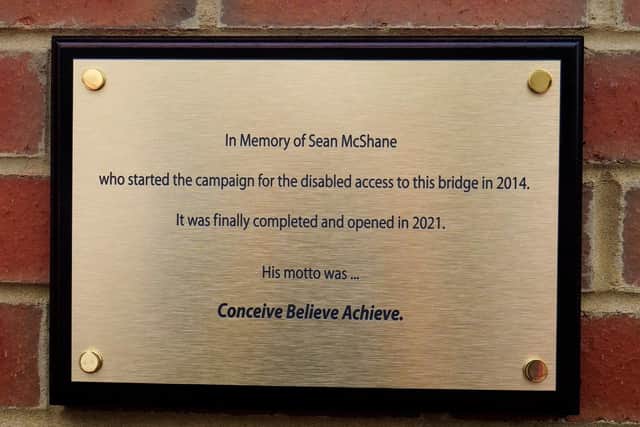 Plaque unveiled at Lancing's Widewater Lagoon in memory of Sean Mcshane and his hard work campaigning for an accessible bridge. Photo by David Hoggen