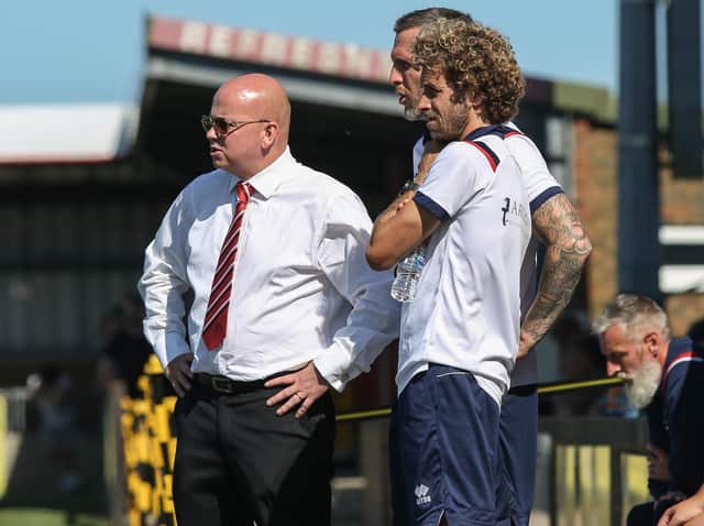 Danny Bloor and his coaches - including the departing Sergio Torres - watch on against Hampton and Richmond / Picture: Andy Pelling