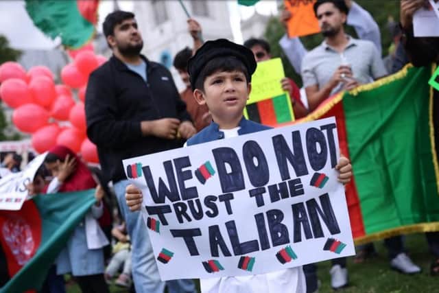LONDON, UNITED KINGDOM - AUGUST 18: Protesters gather on Parliament Square to protest against the Taliban take over of Afghanistan on August 18, 2021 in London, United Kingdom. House of Commons Speaker, Sir Lindsay Hoyle, recalled parliament from its summer recess to debate the situation in Afghanistan after a request from the government. (Photo by Dan Kitwood/Getty Images)