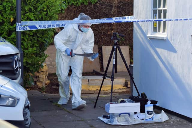 Police investigate near an address in Eastbourne where Lewis Ashdown was found