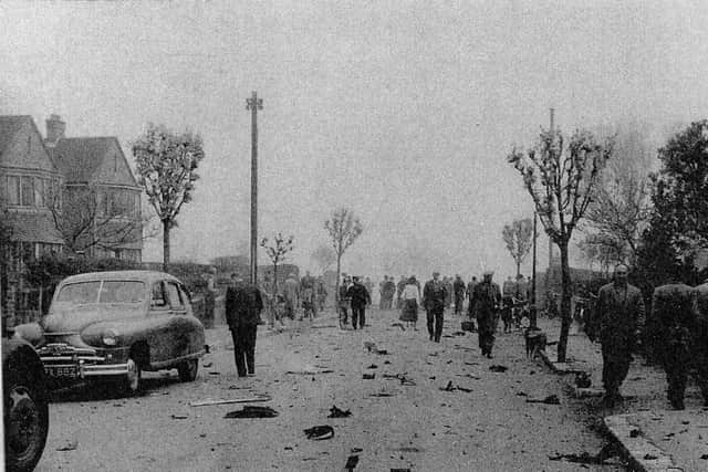 Wreckage still smouldering in Croft Avenue. Photo by Peter Sayer.