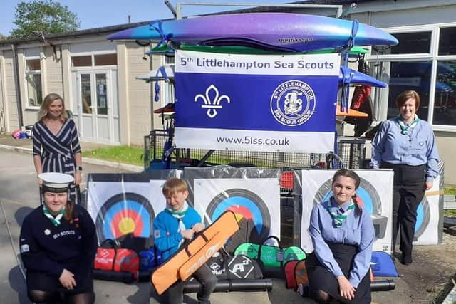 Thrilled with the new equipment, 5th Littlehampton Sea Scouts chairman Rachel Kerwock, left, and Scout leader Laura Stoddart with Scout Abigail Little, Beaver Matthew Kerwick and Young Leader Rhianna Stoddart