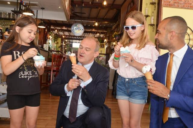 Liberal Democrat Leader Sir Ed Davey MP making and serving ice cream at Gianni's restaurant and ice cream parlour in Eastbourne.

L-R: Amber Garcia, Sir Ed Davey, Willow Barnes and Josh Babarinde OBE SUS-210824-161147001