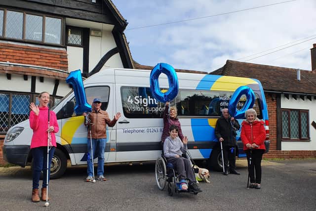 4Sight Vision Support members celebrating the charity's 100th annivesary at the head office in Bognor Regis