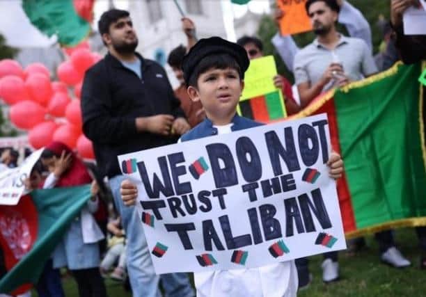 LONDON, UNITED KINGDOM - AUGUST 18: Protesters gather on Parliament Square to protest against the Taliban take over of Afghanistan on August 18, 2021 in London, United Kingdom. House of Commons Speaker, Sir Lindsay Hoyle, recalled parliament from its summer recess to debate the situation in Afghanistan after a request from the government. (Photo by Dan Kitwood/Getty Images)