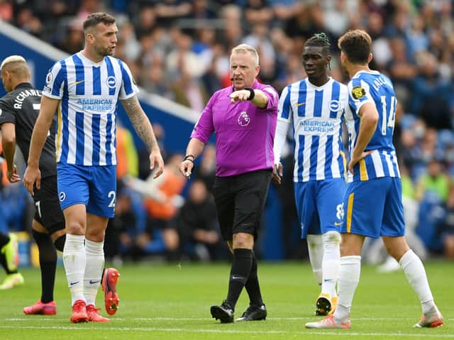 Referee Jonathan Moss awarded a penalty to Everton after Brighton's Joel Veltman brought down Seamus Coleman. (Photo by Mike Hewitt/Getty Images)
