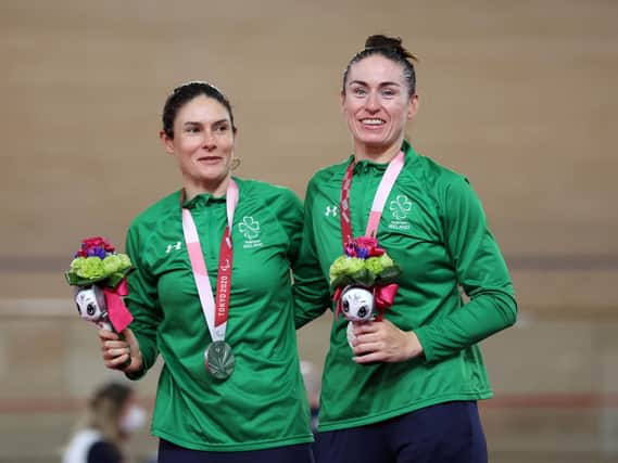 Katie-George Dunlevy (left) and Eve McCrystal, pictured receiving silver in the B 3,000m individual pursuit, won Paralympic gold in the women’s B time trial at the Fuji International Speedway in Tokyo this morning. Picture by Kiyoshi Ota/Getty Images