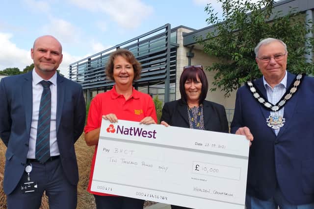Cheque presentation (left to right): Shaun Peters, Gerry Howitt from BHCT, Julie Warrilow and Wealden council chairman Ron Reed. SUS-210831-153902001