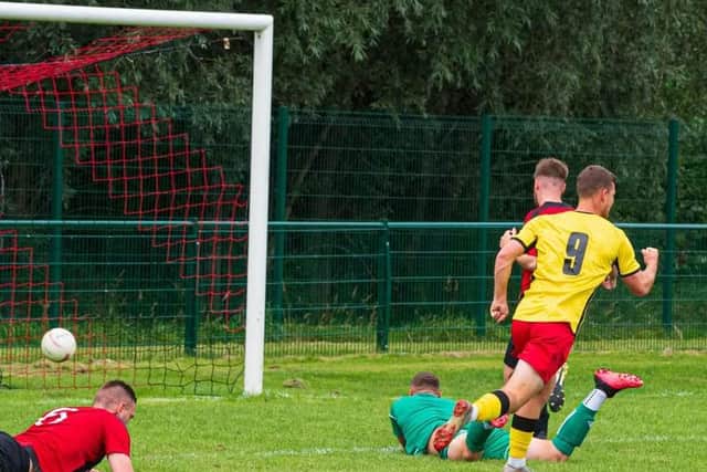 Conor Bull scores one of the four goals he put away for Wick at Billingshurst / Picture: Tommy McMillan