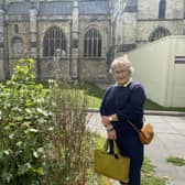 Cllr Sarah Quail and the overgrowing weeds outside Chichester Cathedral SUS-210209-083215001