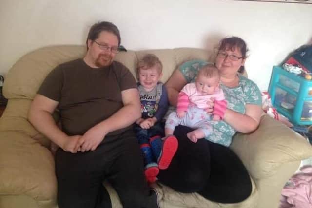 Samantha Keegan with her partner and two children SUS-210209-093519001