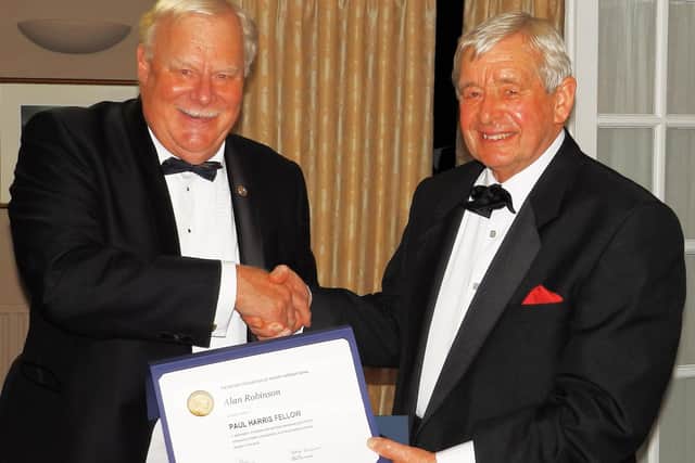 From left: Roger Stent, district governor Rotary South, presents Alan Robinson of Park Farm, Wivelsfield, with a Paul Harris Fellowship. Picture: Rotary Club of Cuckfield and Lindfield.