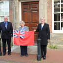 Cllr Peter Burgess Armed Forces Champion, Vice Chairman Kate Rowbottom and Cllr Karen Burgess with the Red Ensign flag