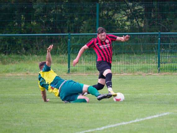 Callum Nash is brought down in the box for Billingshurst's opener. Pictures by Iain Gibson