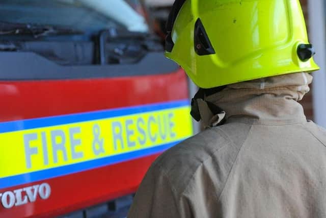 Police officers are assisting firefighters at the scene of the incident at Alfriston