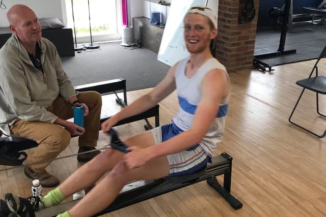 Jack Bates from Shoreham Rowing Club taking his turn on the rowing machine to beat the exisiting world record in tandem rowing