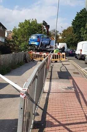The area was cordoned off as the car was recovered following the collision. Picture by Simon Stevens SUS-210609-102101001