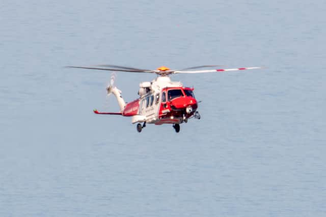 Coastguard helicopter. Picture from Peter Abel SUS-200527-123151001