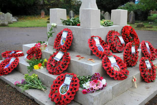 Wreaths laid at the war memorial at St John's Church, Crawley. Picture by Steve Robards