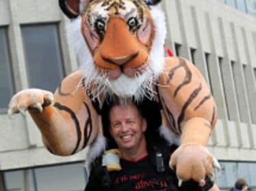 Paul Goldstein will be running the marathon in his tiger suit to raise money for the protection and conservation of the endangered Bengal tigers