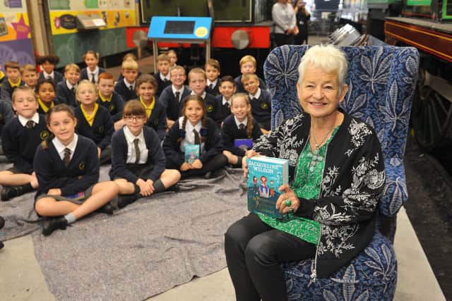 Jacqueline Wilson with pupils from St Giles Church of England Primary School in Horsted Keynes at Bluebell Railway’s Sheffield Park Station. Photo by Steve Robards, SR2109141.