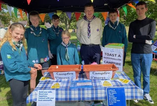 Newly appointed Mid Sussex Scout District Commissioner Mark Scholfield (centre) with Scouts from across Haywards Heath at the ’S’more Bar'. Picture: Mid Sussex District Scouts.